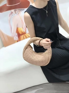 Handwoven khaki crescent tote bag with premium leather texture for stylish women