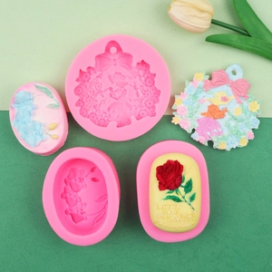 Detail of floral silicone mold showing embossed rose and orchid resin pendant designs