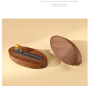 Macro view of walnut wood ring display box with velvet slot and pearl ring show