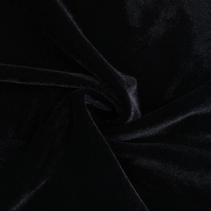 Vue macro détaillée de la texture du tissu en velours noir de qualité avec reflets doux