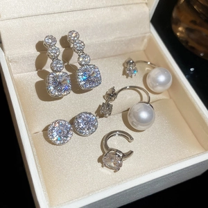 Elegant jewelry set with sparkling zircon earrings and pearls in a premium gift box