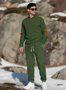 Close-up of green knit set with diamond texture and brown leather elbow patches
