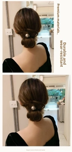 Detail showing a minimalist silver metal ball hair tie for elegant bun hairstyles