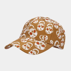 Detail of red-eyed skull print and fine stitching on a brown baseball cap