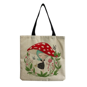 Detail of mushroom girl illustration and floral wreath on beige canvas tote bag
