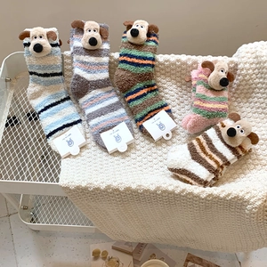 Detailed view of thick striped coral fleece socks with 3D cartoon dog ears decor