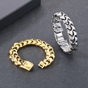 Punk style dragon bone chain bracelets in gold and silver steel on black background