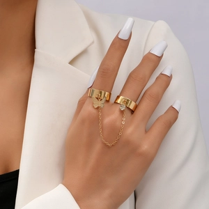 Detailed shot of golden butterfly chain link ring with sparkling rhinestone charms