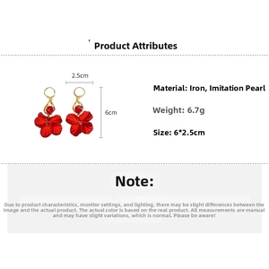 Detail view of red petal earrings with pearls, showing 6cm height and 2.5cm width specs