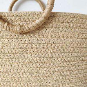 Handcrafted cotton rope woven tote bag with circular handles for beach vacations