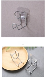 Detail of wall-mounted stainless steel washbasin hook with strong transparent adhesive base