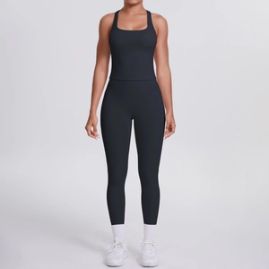 Detail of high-waisted yoga leggings with side pockets and racerback sports bra set