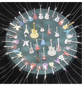 Radial arrangement of colorful guitar pendant necklaces with enamel and rhinestones