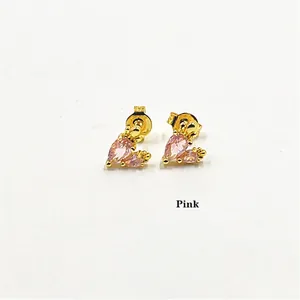 Detail showing elegant gold-plated heart earrings with pink pear-cut zircon stones