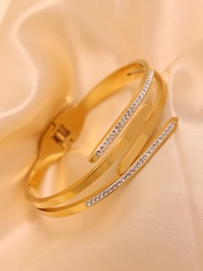 Detail of three-layer 18K gold plated stainless steel bangle with pavé crystals