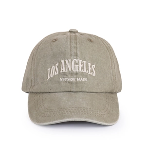 Close-up of Los Angeles white embroidery on washed army green vintage cotton baseball cap