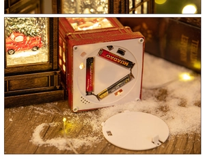 Detail view of the battery compartment for Christmas lantern showing 3 AAA slots