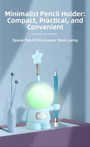 Detail of blue astronaut desk lamp with pencil sharpener and built-in pen holder