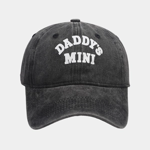 Close-up of DADDY'S MINI print on washed gray vintage baseball cap with stitch detail