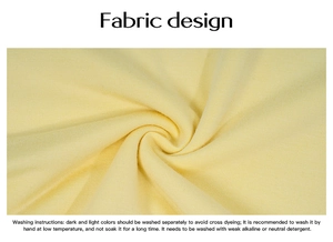 Macro detail of yellow ribbed knit cotton fabric texture with English washing instructions