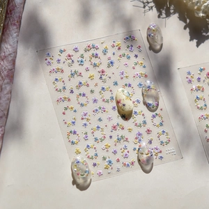 Detailed close-up of TS-100 floral nail art stickers with delicate dried flower patterns