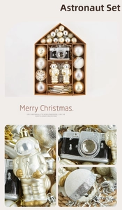 Macro details of astronaut and camera shaped Christmas tree ornaments in gold and silver