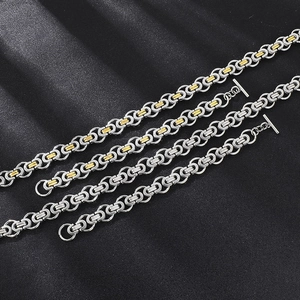 Detail of Byzantine style stainless steel chains in silver and two-tone gold finishes