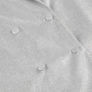 Close-up of silver-gray sequin textured fabric with fabric-covered buttons on the outfit