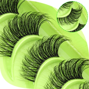 Macro detail of natural voluminous half lashes with clear band in a green tray