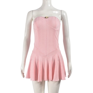 Close-up of pink strapless pleated dress with a yellow floral ornament detail