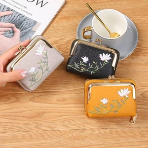 Lychee pattern PU leather wallet with floral embroidery and metal clasp closure