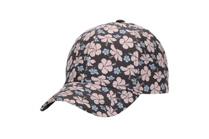Detail of floral baseball cap showing pink hibiscus print on dark fabric texture