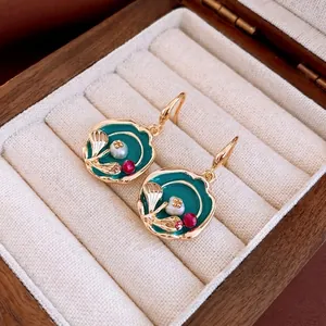 Vintage gold plated enamel earrings with pearl and crystal in a luxury jewelry box