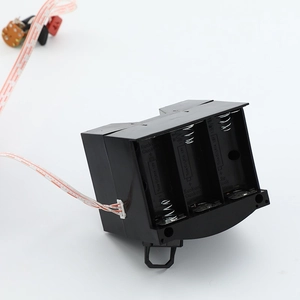 Modern black cuckoo clock battery compartment for three C-size 1.5V batteries with cable