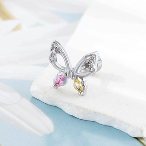 Silver butterfly ear stud with zircon wings and pink yellow gems on white stone