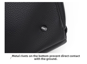 Detail of durable metal rivets on the leather bag bottom for anti-wear protection