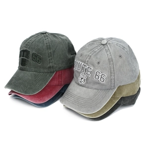 Detail of vintage washed cotton baseball caps with Route 66 shield embroidery in six colors