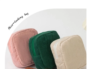 Detail showing colorful portable corduroy makeup storage bags with zipper closure