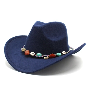 Detail of navy blue felt fedora featuring an ethnic braided band with turquoise beads