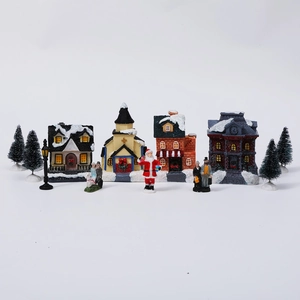Detailed view of an 11-piece miniature Christmas village set with light-up houses and figures