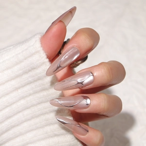 Long almond cat eye press-on nails with silver 3D liquid metal line art and glossy finish