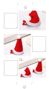 Detail of red felt Christmas hat hair clips with white pom-poms and metal duckbill pins