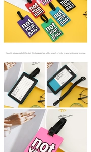 Detail of multi-colored PVC luggage tags showing the information card and strap