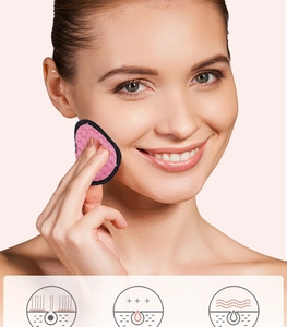 Model using thick pink pineapple pattern cleansing puff for gentle face makeup removal