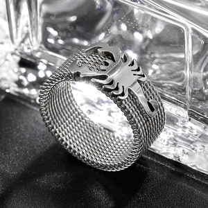 Detailed view of an 8mm silver steel ring with scorpion emblem and mesh band texture