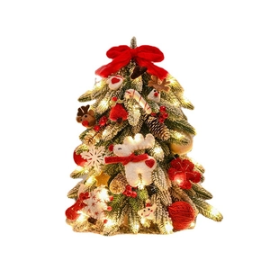 Mini Nordic flocked Christmas tree with warm LED lights and colorful festive ornaments
