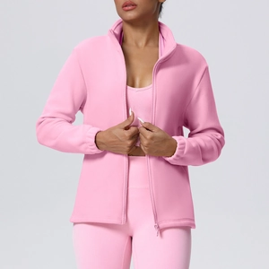 Detailed view of pink fleece sports jacket featuring a high collar and full zipper closure