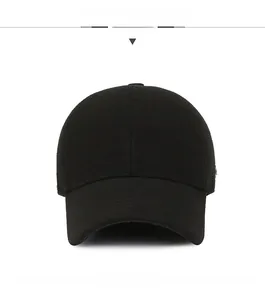 Front view of solid black baseball cap with structured panels and curved brim details
