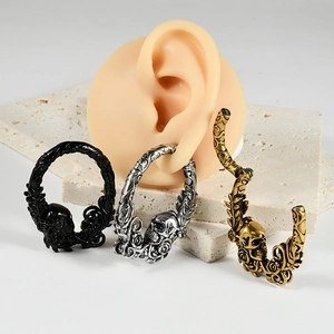Skull and vine engraved stainless steel ear gauges in black, silver, and bronze