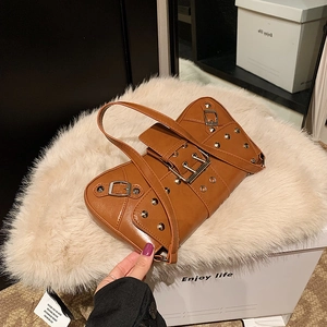 Punk style brown rivet shoulder bag with metal buckles and faux leather motorcycle aesthetic